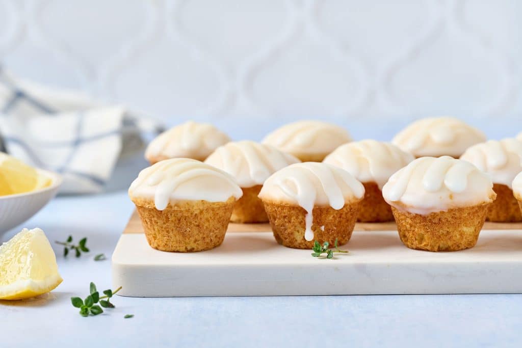 Lemon blossoms mini muffins dipped and drizzled with lemon glaze