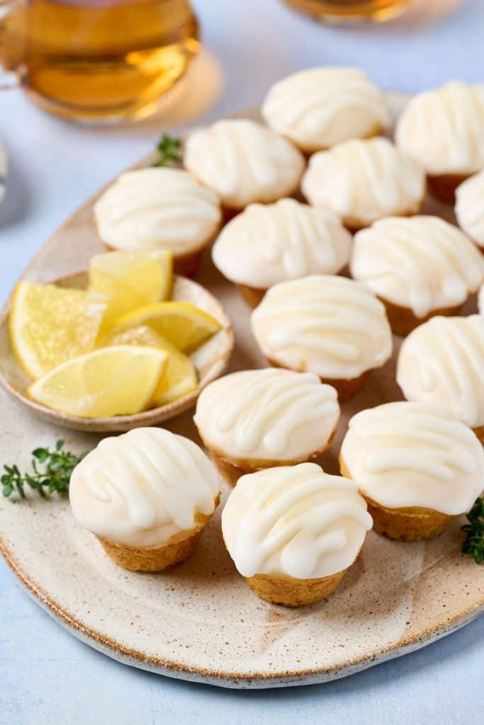 a plate of lemon blossoms with a bowl of lemon slices