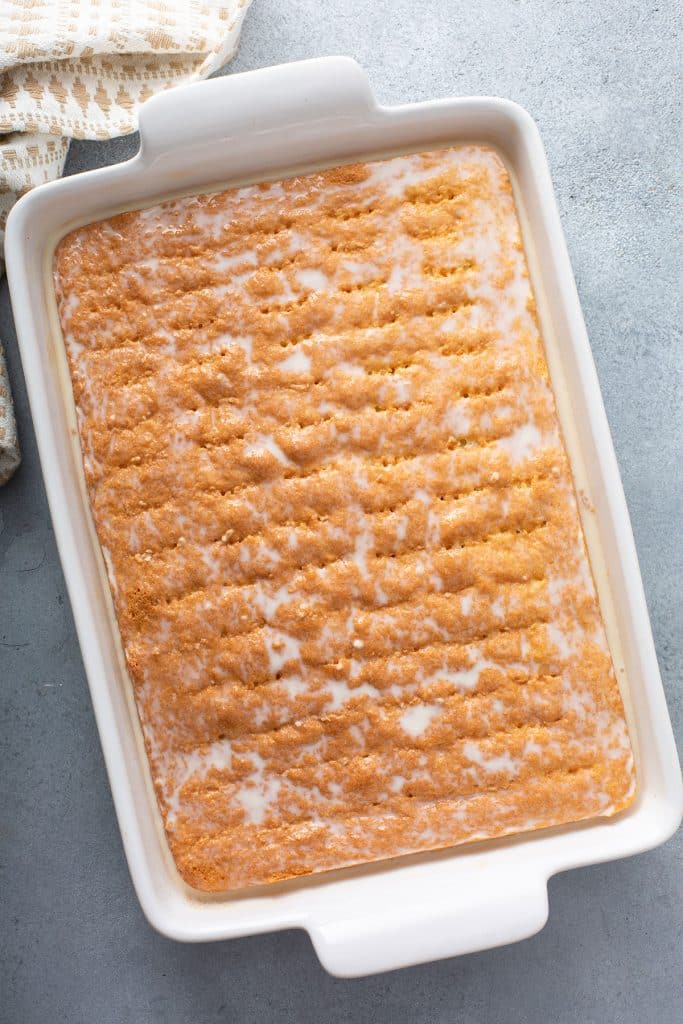 Cake in a baking pan soaked in milk