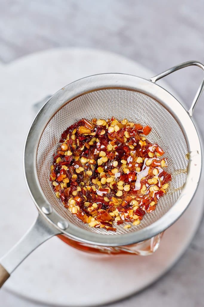 close up of chili flakes on a strainer
