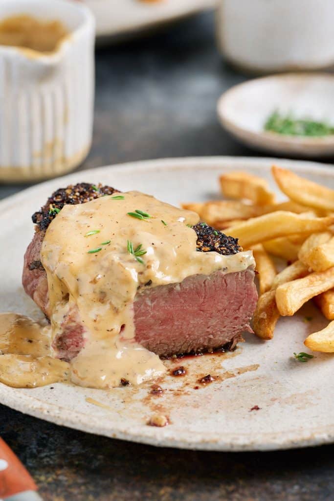 pepper crusted filet with au poivre sauce and french fries