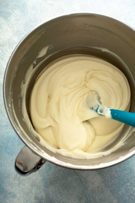 cream cheese frosting on the bowl of a standing mixer