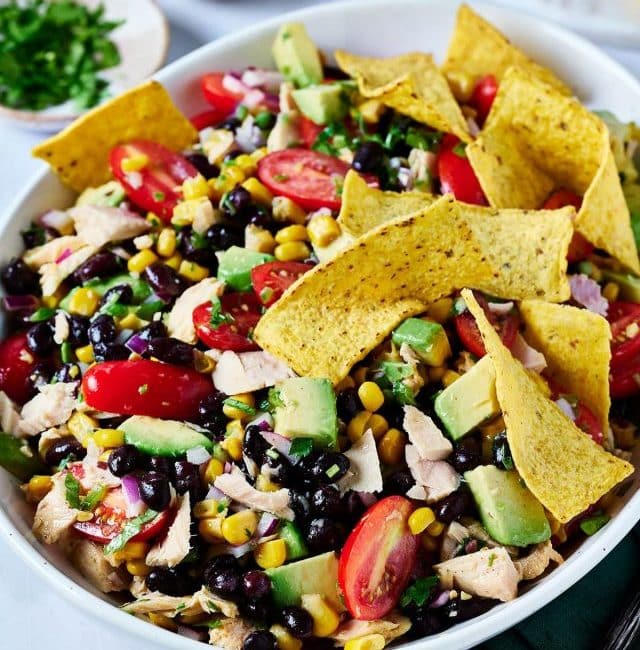 Mexican Tuna Salad (ensalada de atún) brings together lean protein from canned tuna and black beans, crunchy vegetables, creamy avocado and the bright flavors of lime juice and fresh cilantro.
