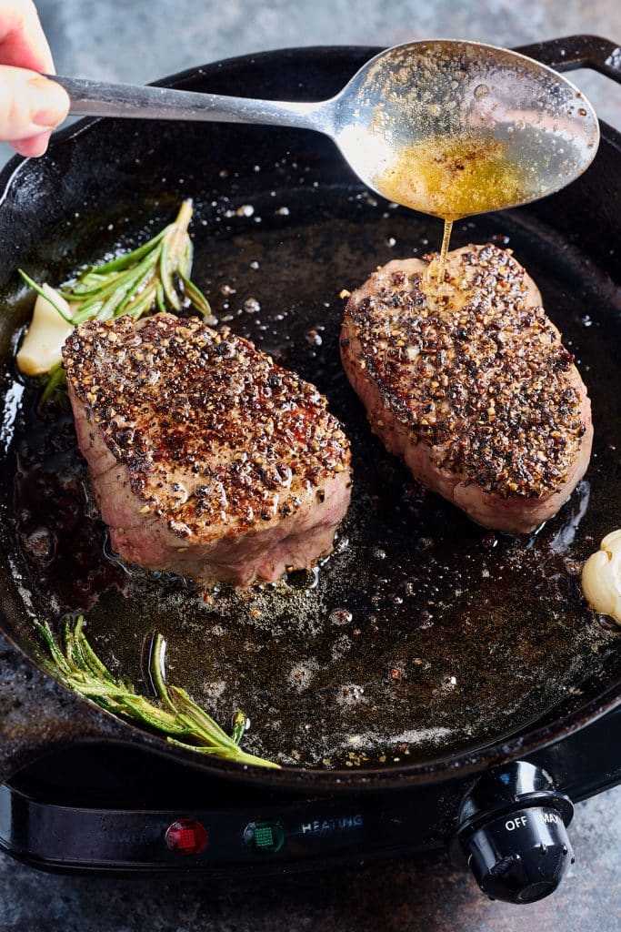 Basting steak with warm butter