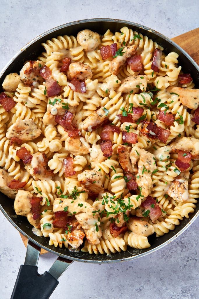 skillet with creamy pasta, chicken and bacon