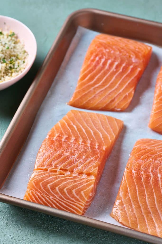 Raw salmon on a sheet pan