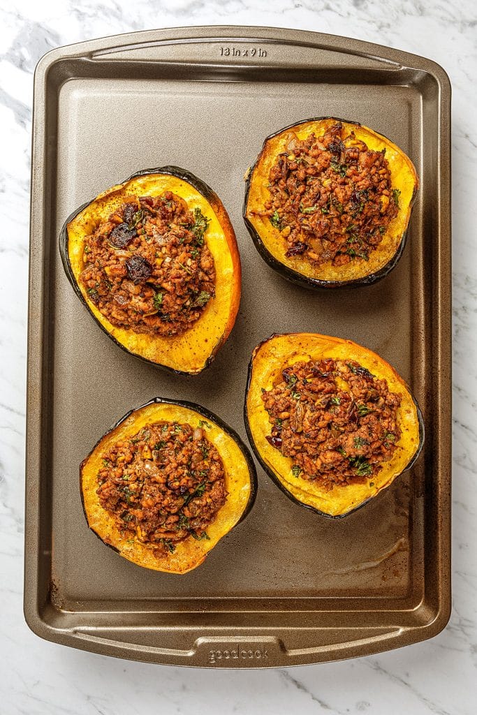 Baked stuffed acorn squash on a pan