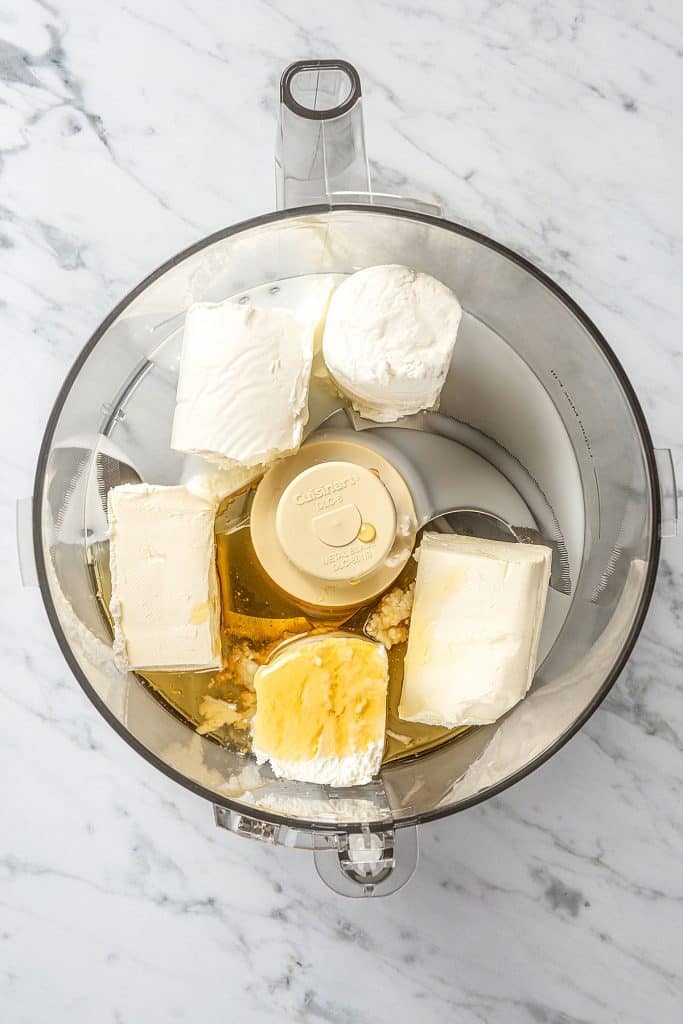Soft cheeses and honey in a food processor