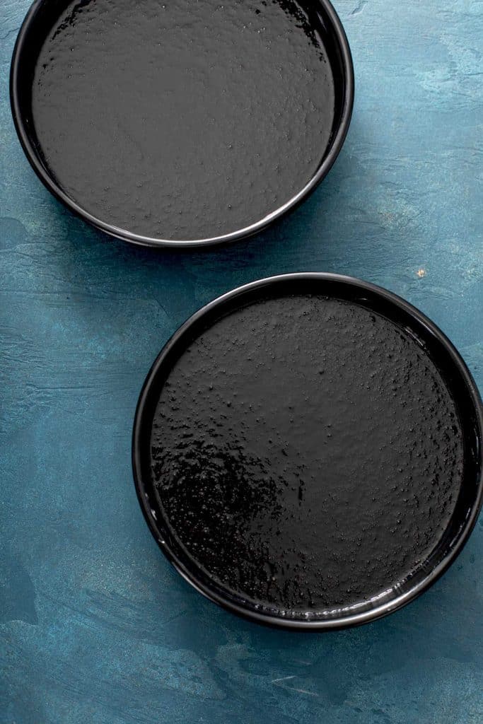 two round pans with cake batter
