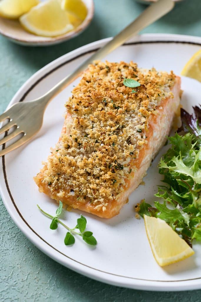 Golden brown crusted salmon on a plate