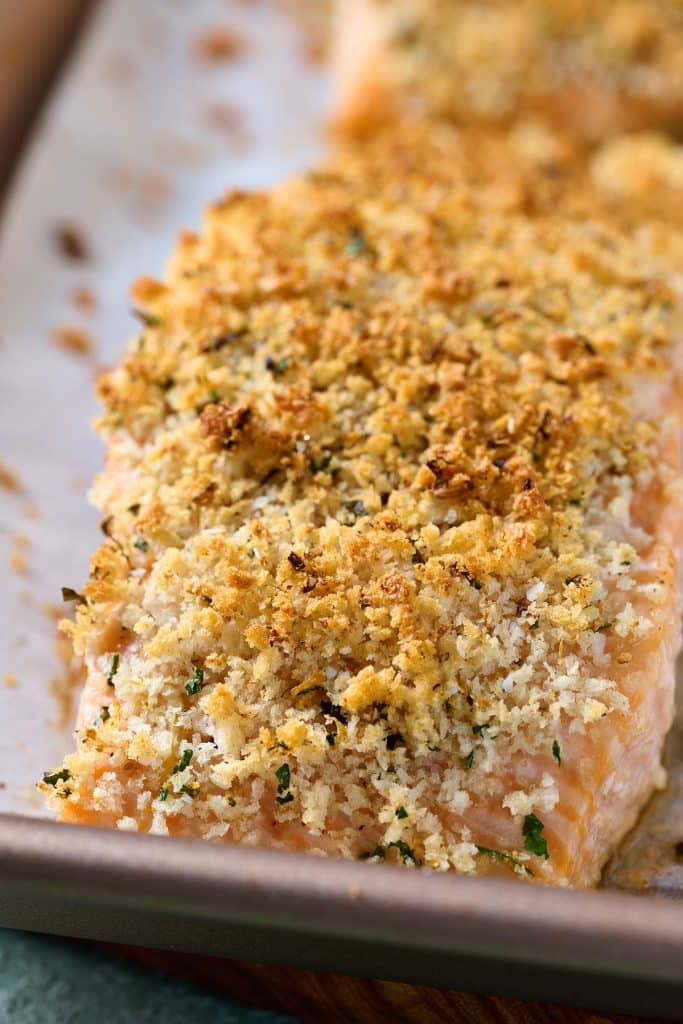 Close up view of crispy golden brown baked panko salmon.