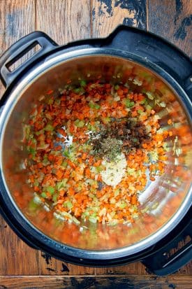 onions, carrots and celery stalks cooked in an instant pot