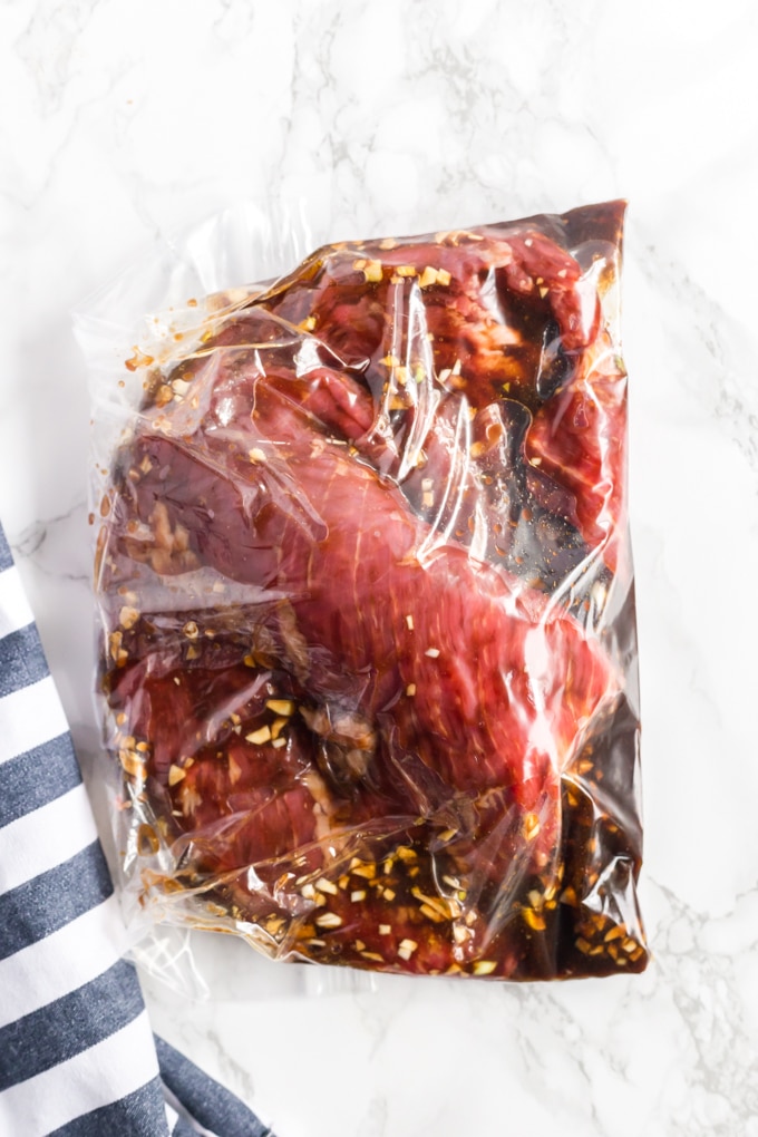 flank steak marinating in a resealable plastic bag