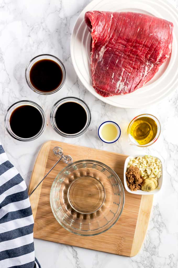 Ingredients to make beef London broil steak and marinade.