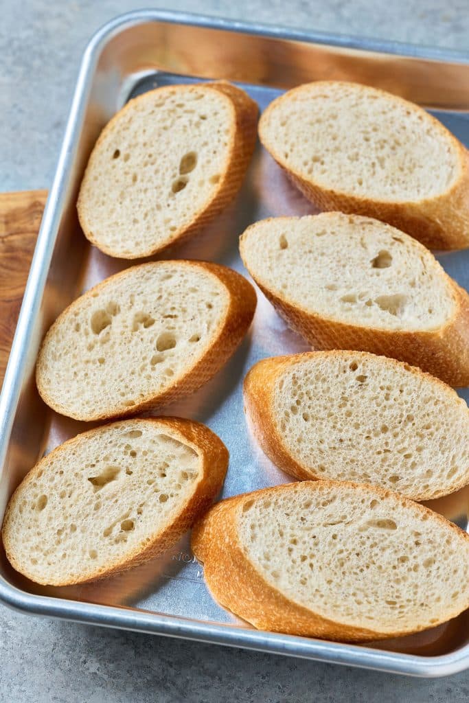 bread slices on a baking sheet.