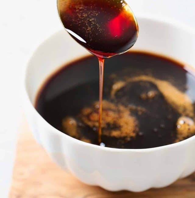 Rich and thick date syrup coating a spoon