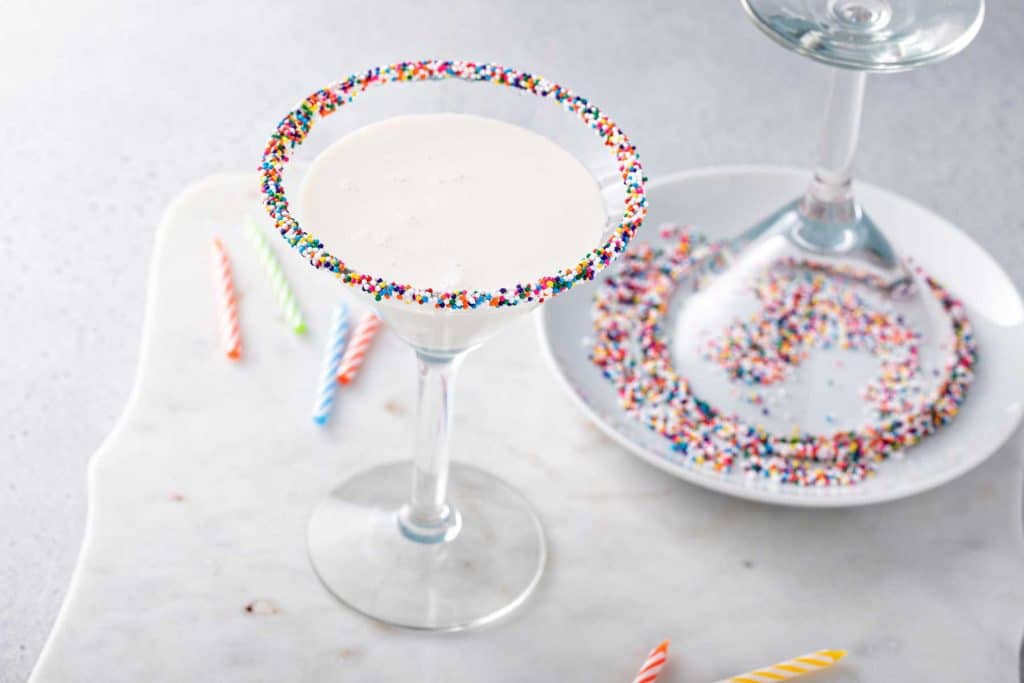 Martini glass dipped in rainbow sprinkles