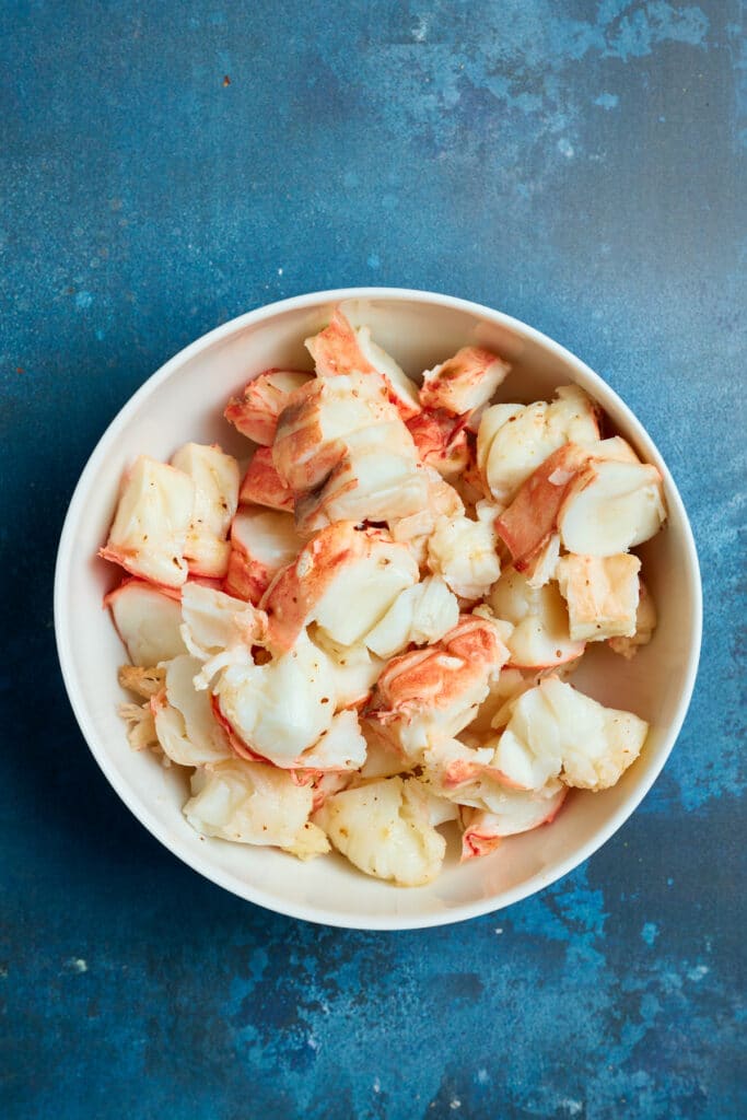 tender cooked lobster tail meat in a bowl