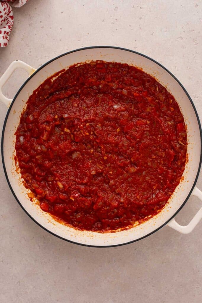 A skillet with caramelized tomato sauce