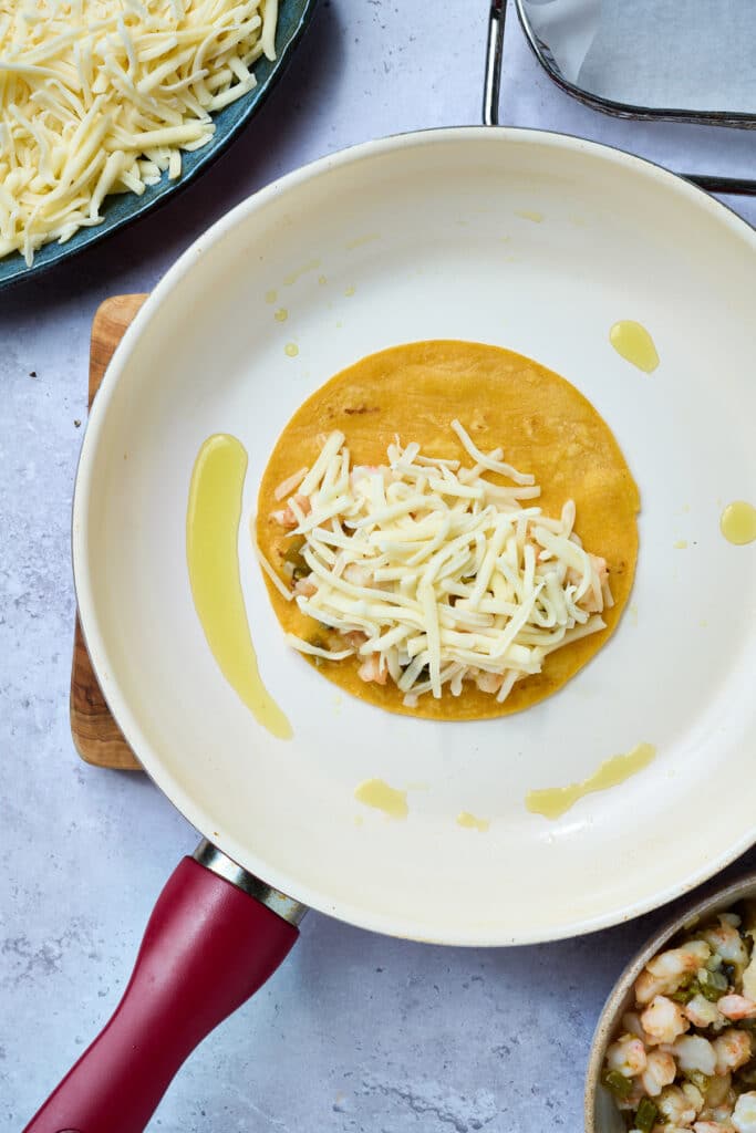 Crispy tortilla topped with shrimp and cheese.