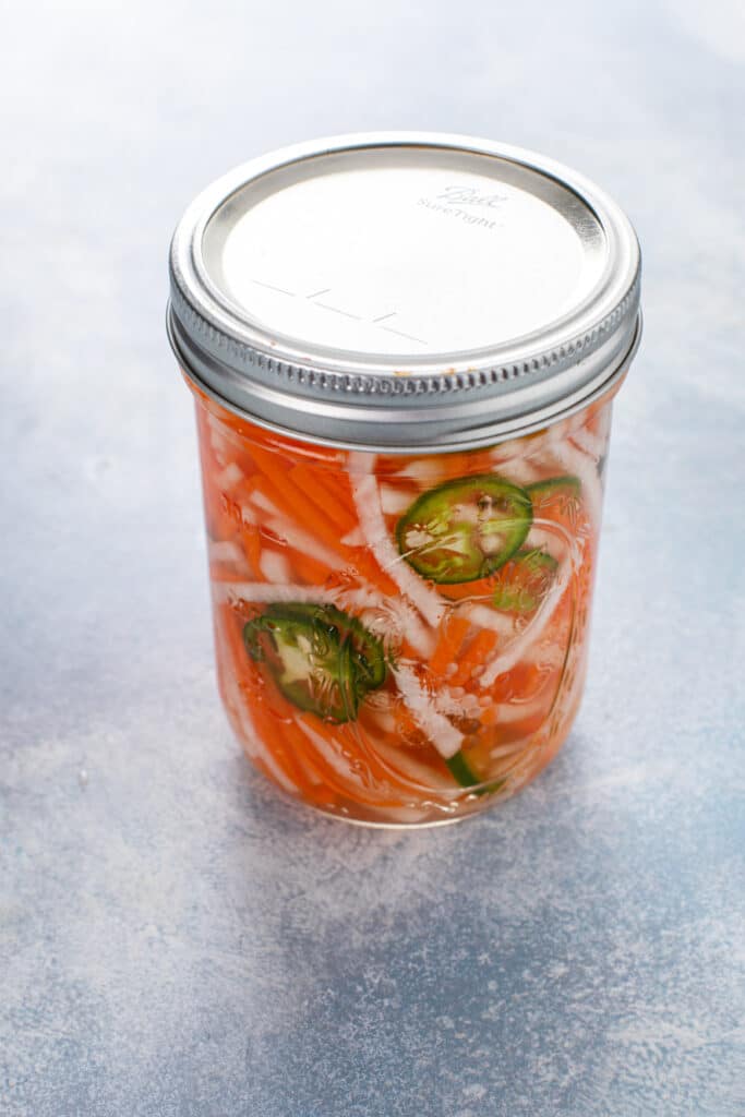 A jar with pickled vegetables