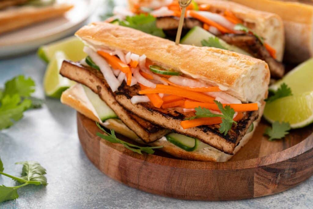 Crispy marinated tofu and pickled veggies on a baguette.
