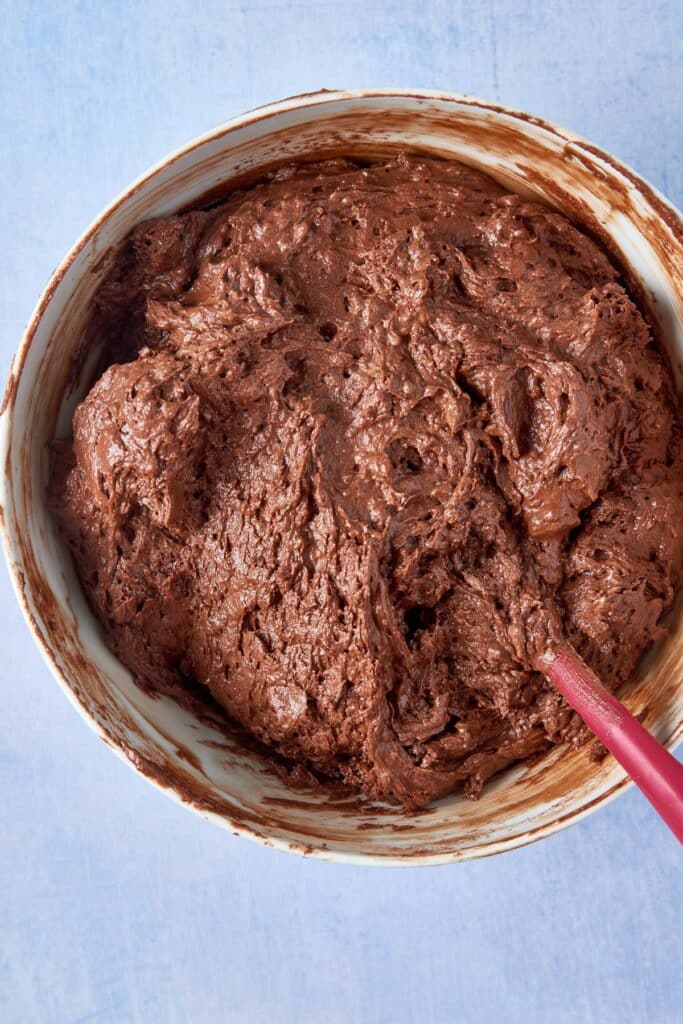 Rich chocolate cupcake batter in a bowl