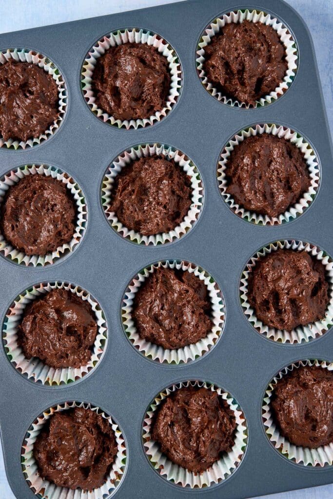 Filled cupcake pan with chocolate batter