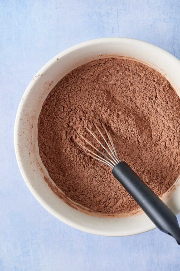 Dried ingredients to make chocolate cupcakes in a mixing bowl