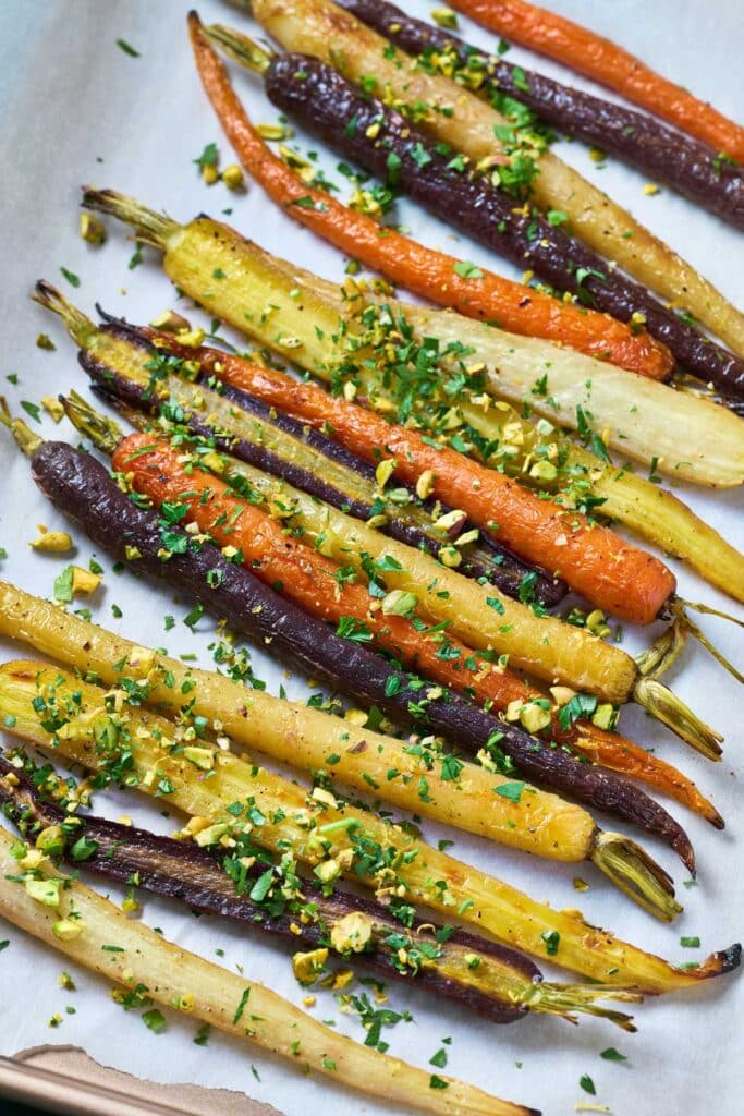 Roasted rainbow carrots tossed with pistachios and fresh herbs and garlic gremolata
