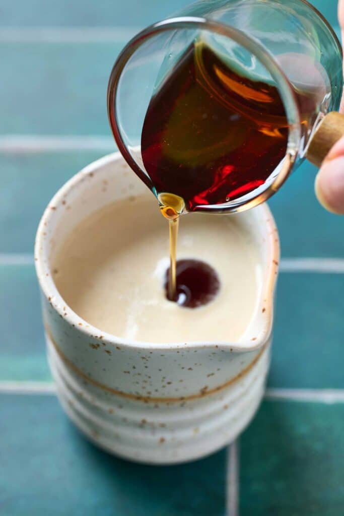 Adding maple syrup into tahini sauce