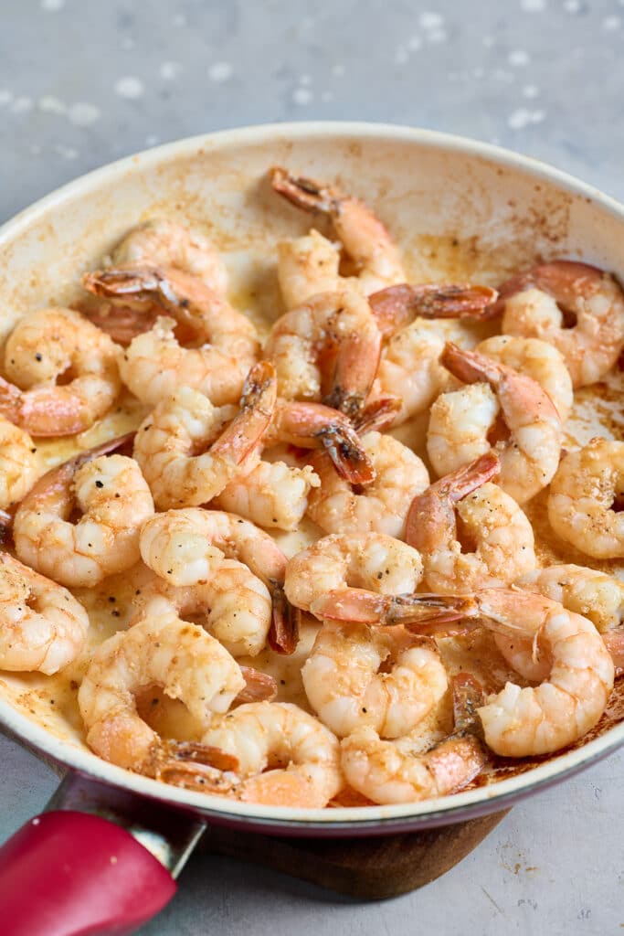 Cooked large shrimp in a skillet