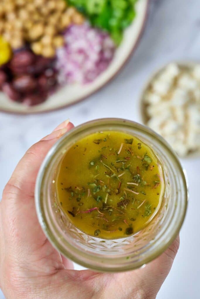 Greek salad dressing in a container