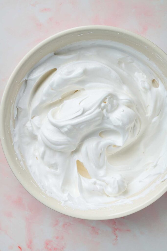 Fluffy and glossy meringue whisked to stiff peaks