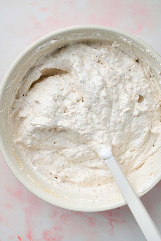 Mustachon cake batter made with meringue with crushed cookies and nuts