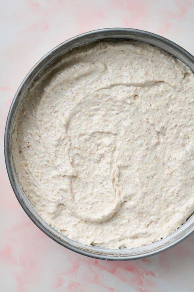Mustachon cake batter in a spring form pan ready to be baked