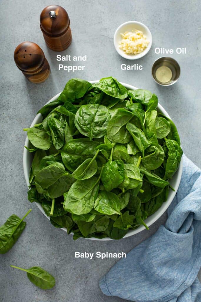 Ingredients to make sautéed spinach with garlic