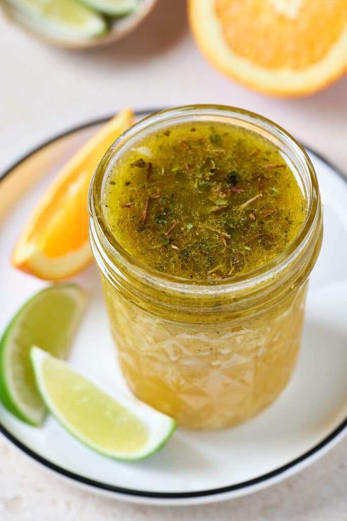 a glass jar with mojo sauce