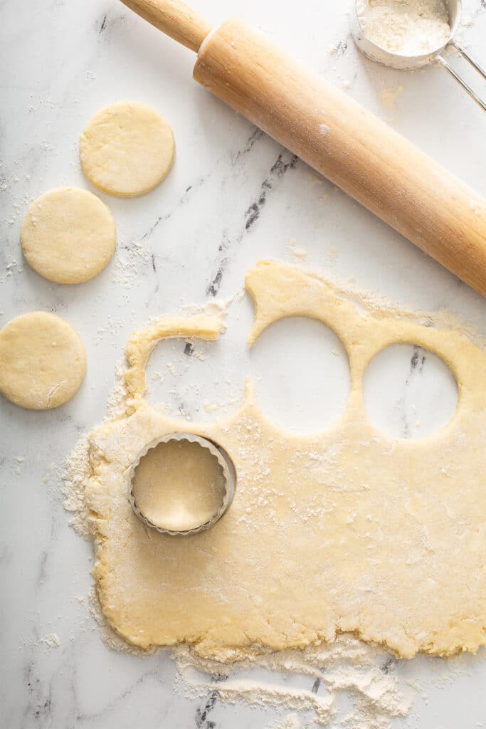 Biscuit cutter on top of biscuit dough