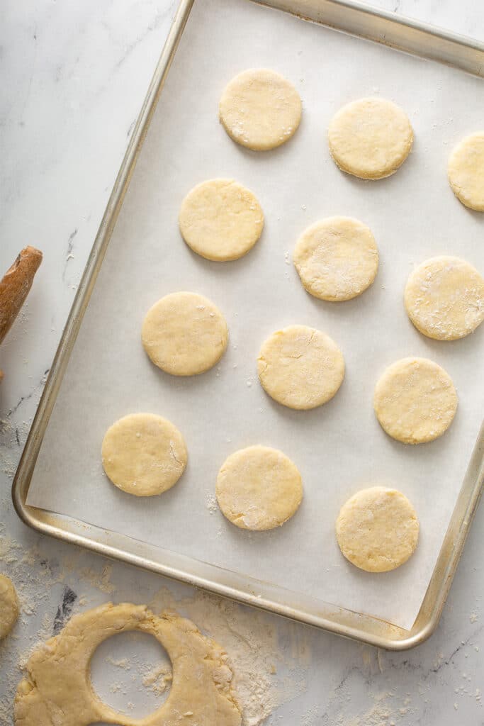 Biscuit dough on a parchment paper lined sheet pan