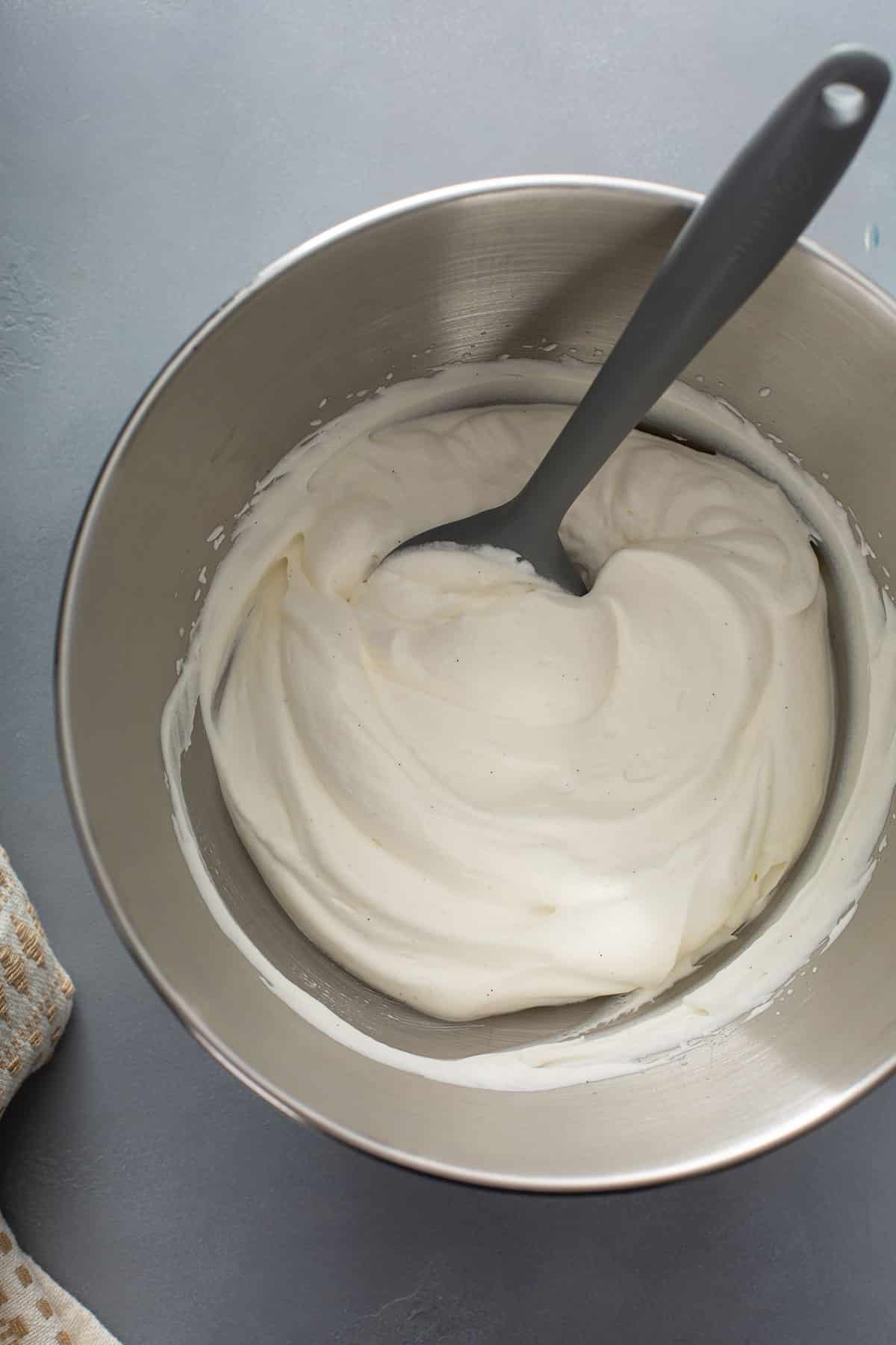 Whipped cream in a metal bowl