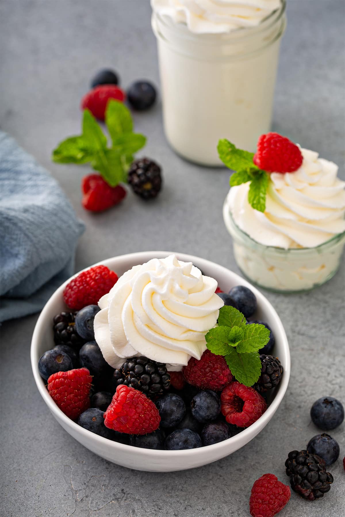 Dollop of vanilla whipped cream served with fresh berries