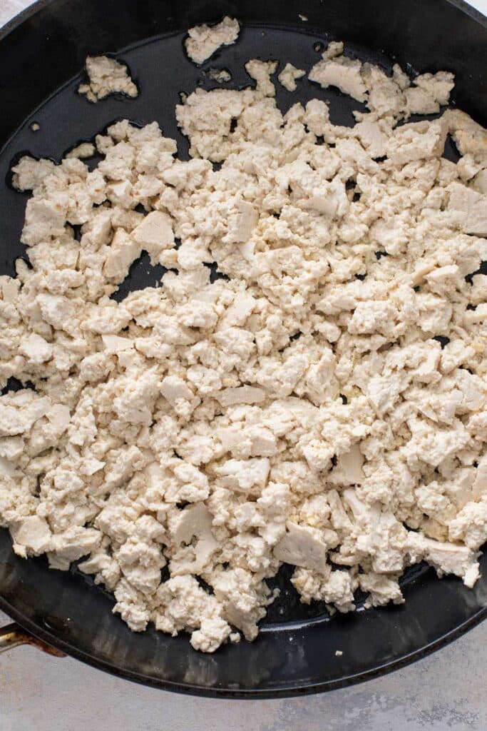 Firm tofu crumbled into a large skillet