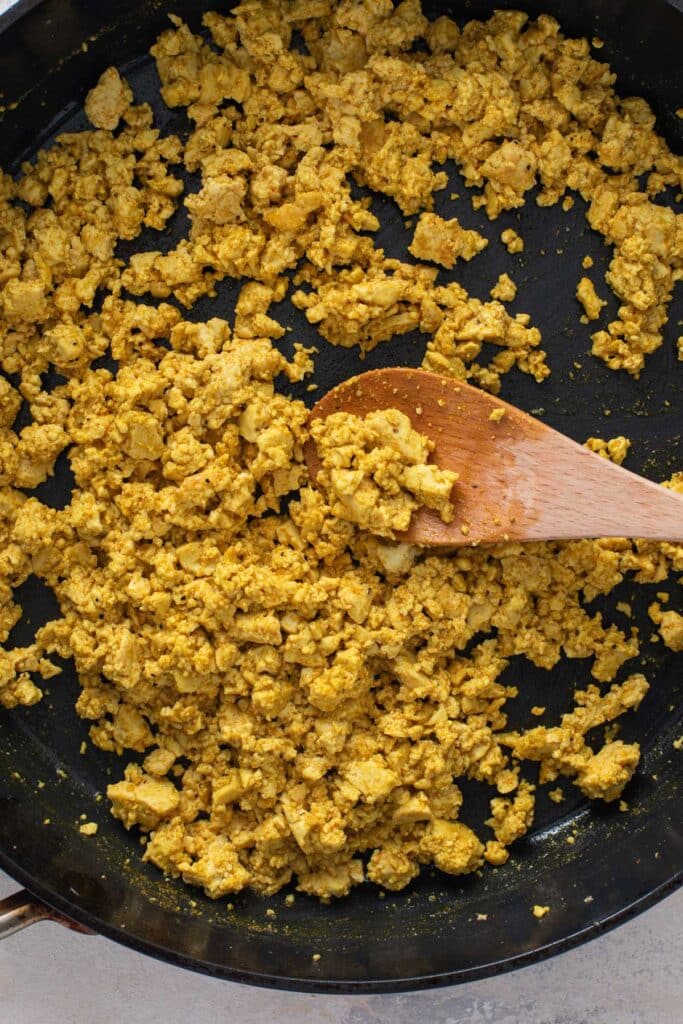Seasoned golden tofu scramble in a skillet