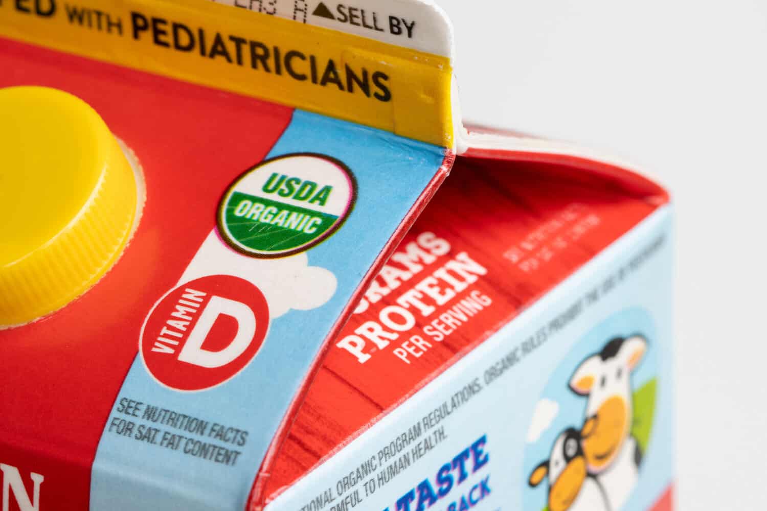 Close-up of an organic milk carton showing the USDA Organic seal.