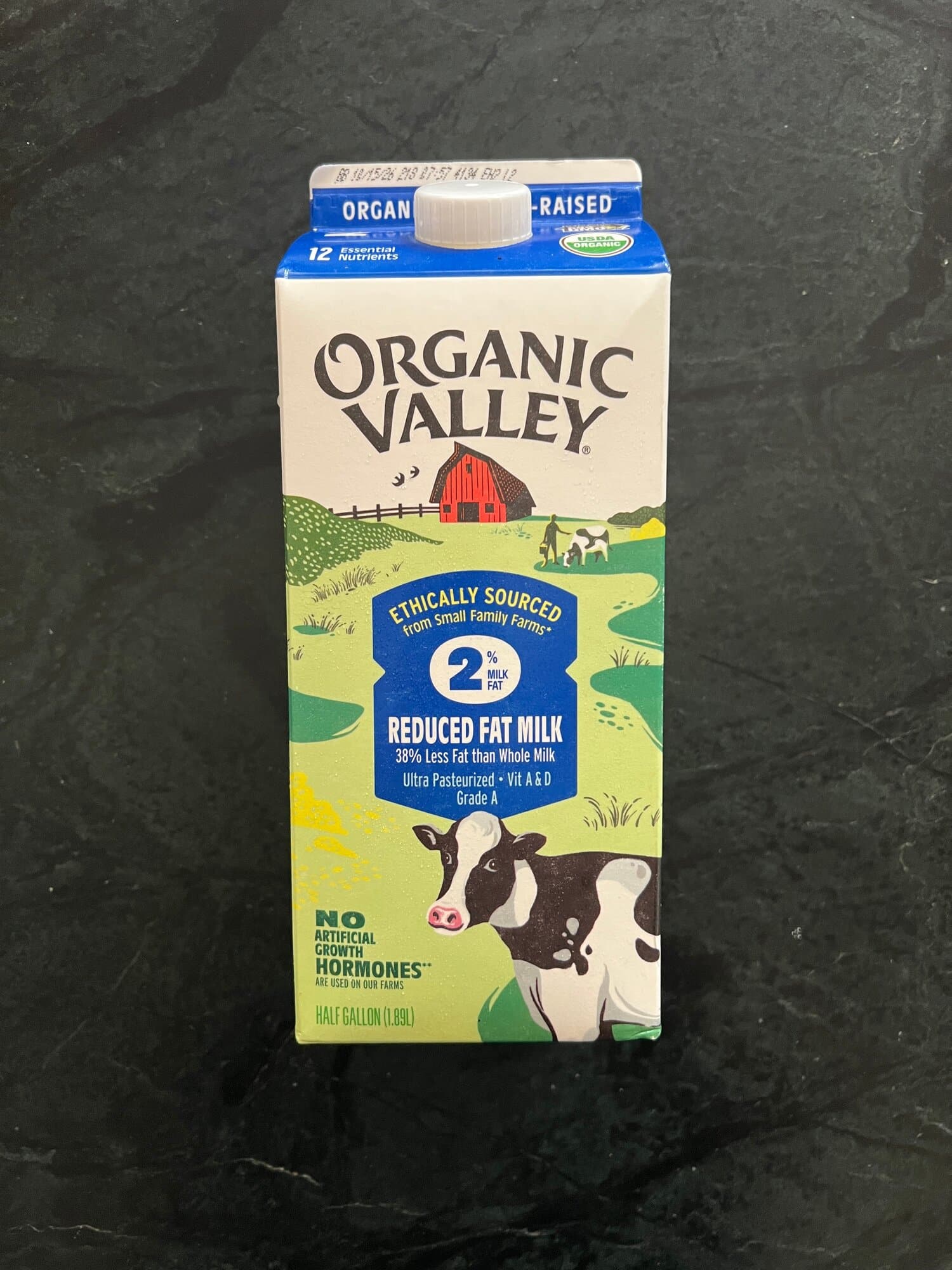 An Organic Valley carton of reduced fat milk with organic and pasture-raised claims on the label.